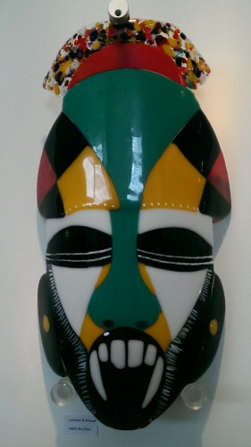Glass mask in green, white, black, yellow and red