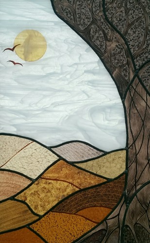 Stained glass panel in browns and white