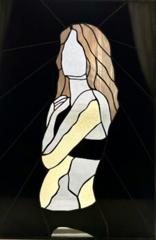 A stained glass portrait of a woman, with a black background